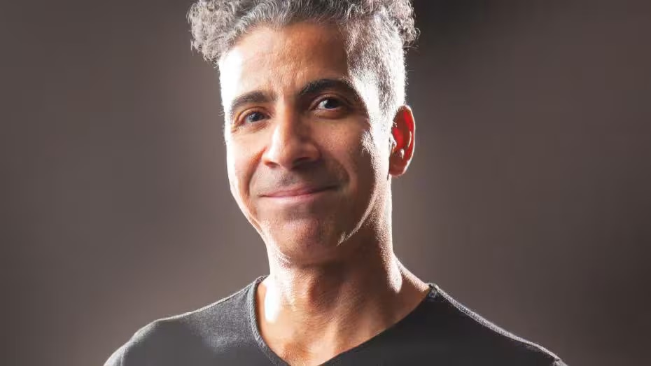 A man is smiling at the camera.